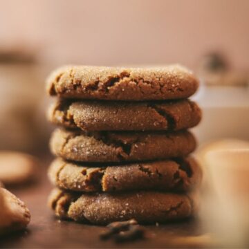 A stack of molasses cookies with spices.