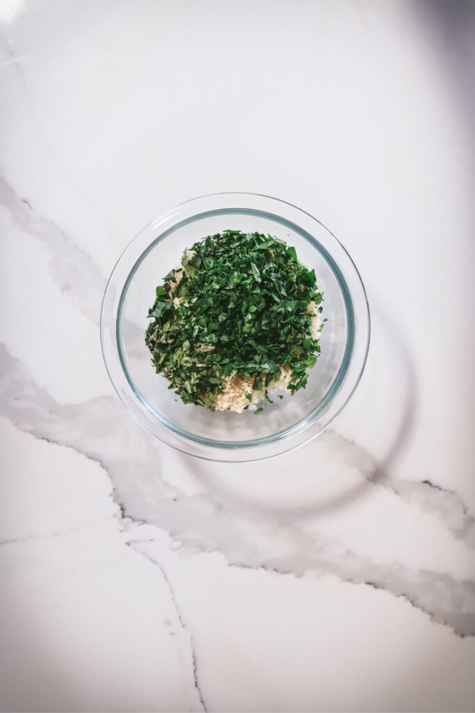 Panko, herbs, oil, salt and pepper in a bowl. 