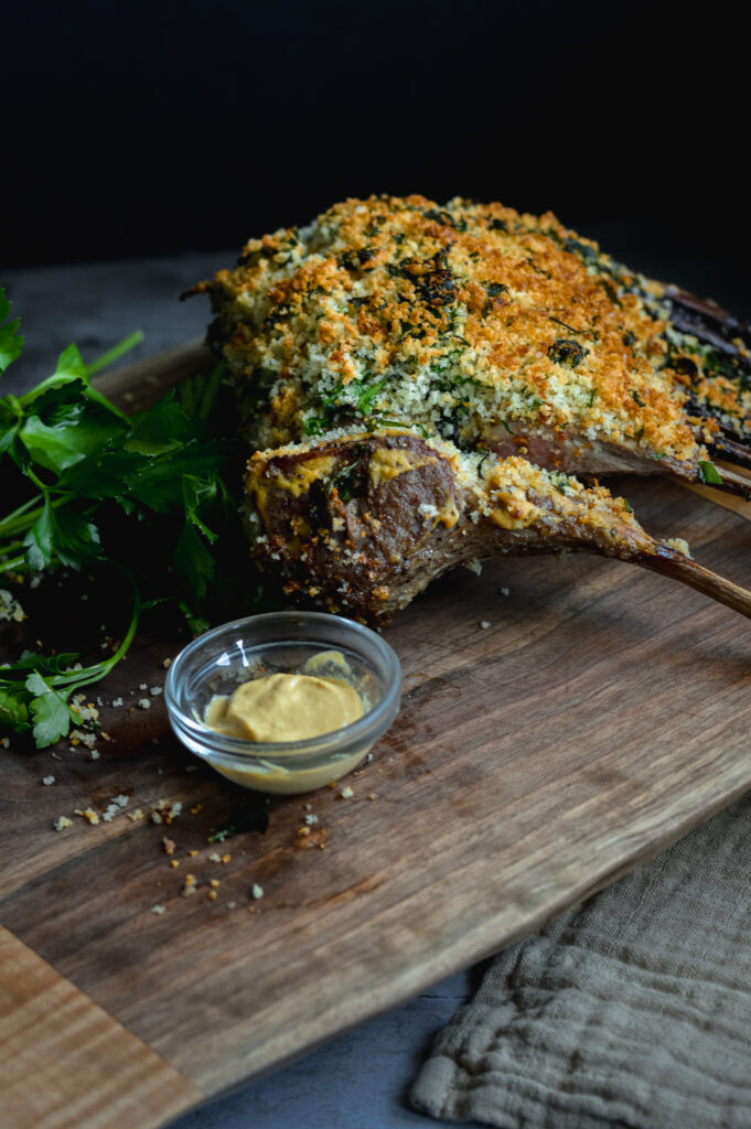 A photo of an herb crusted rack of lamb