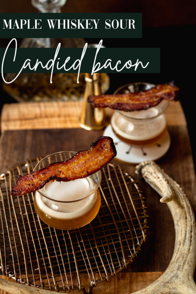 Two glasses of maple whisky sours with candied bacon