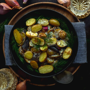 A bowl of easy roasted potato salad with dill and white wine