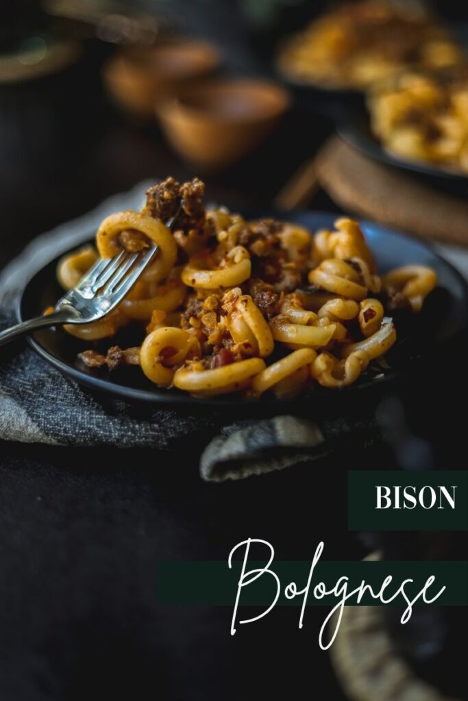 A plate of bison bolognese with sage and spices