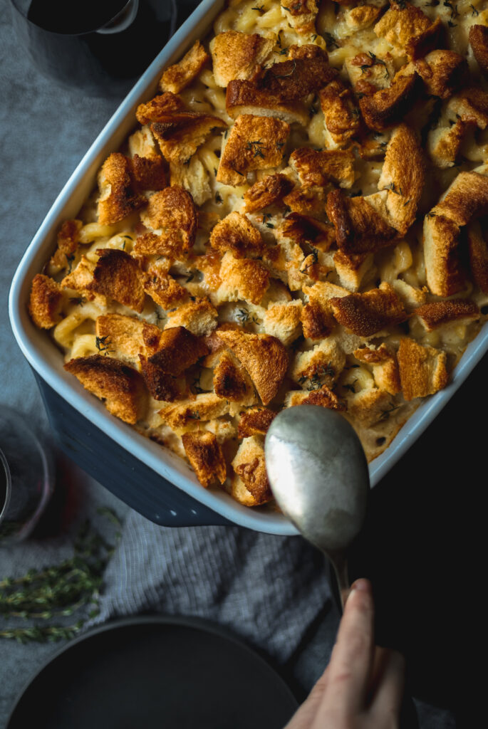 A large pan of smoked gouda mac and cheese with crispy breadcrumbs