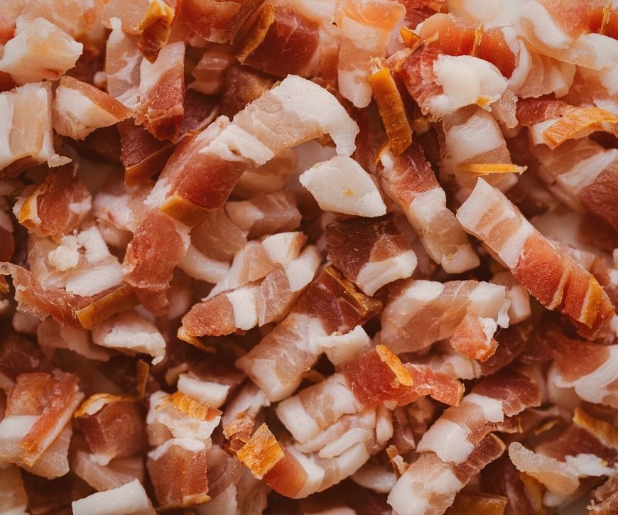 A photo of raw, chopped bacon