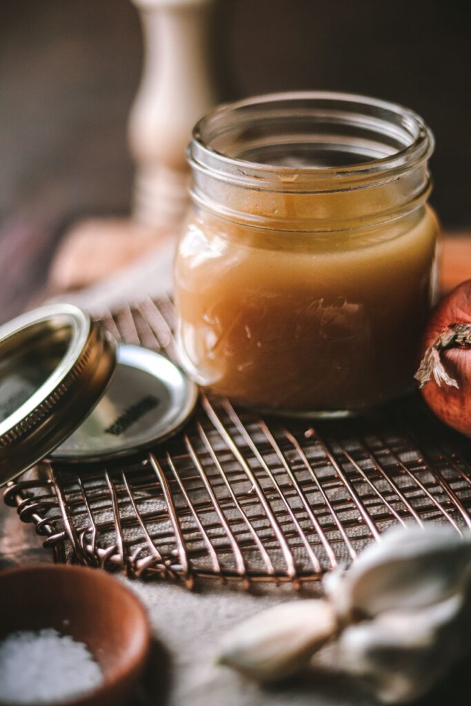 A photo of easy homemade chicken broth in a jar