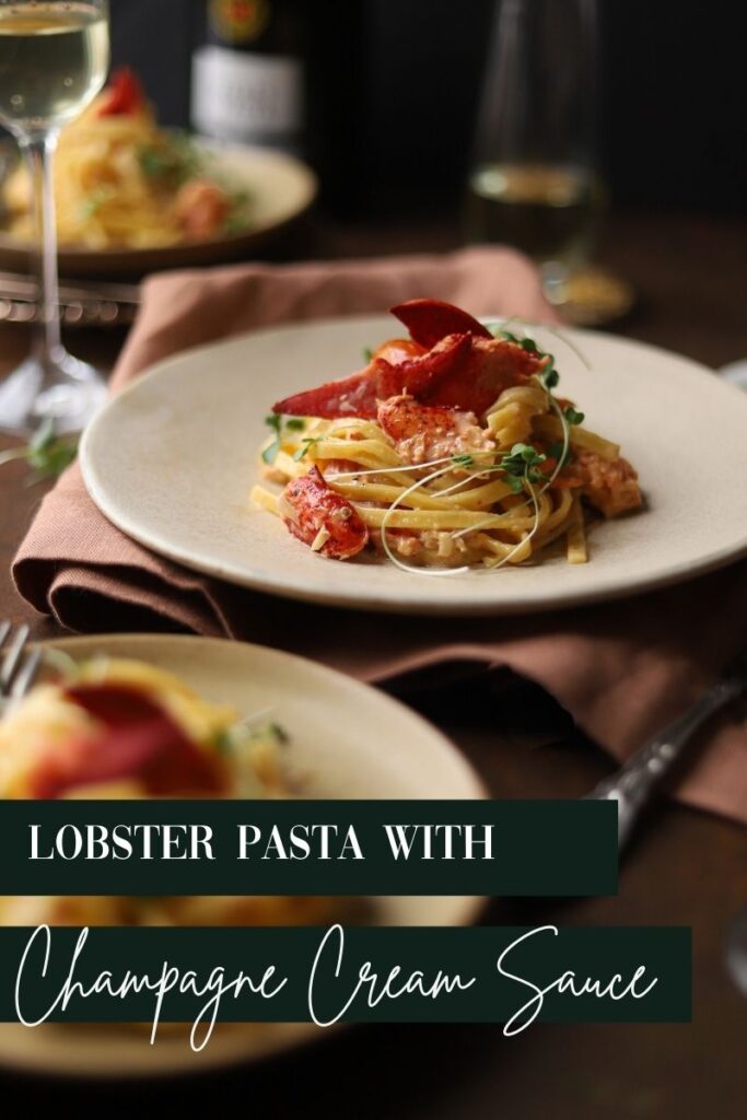 A photo of lobster pasta surrounded by glasses of champagne