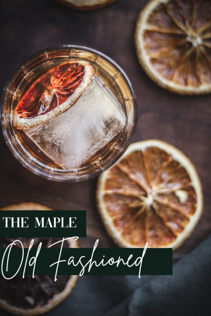a photo of a maple old fashioned cocktail with dried oranges and title text