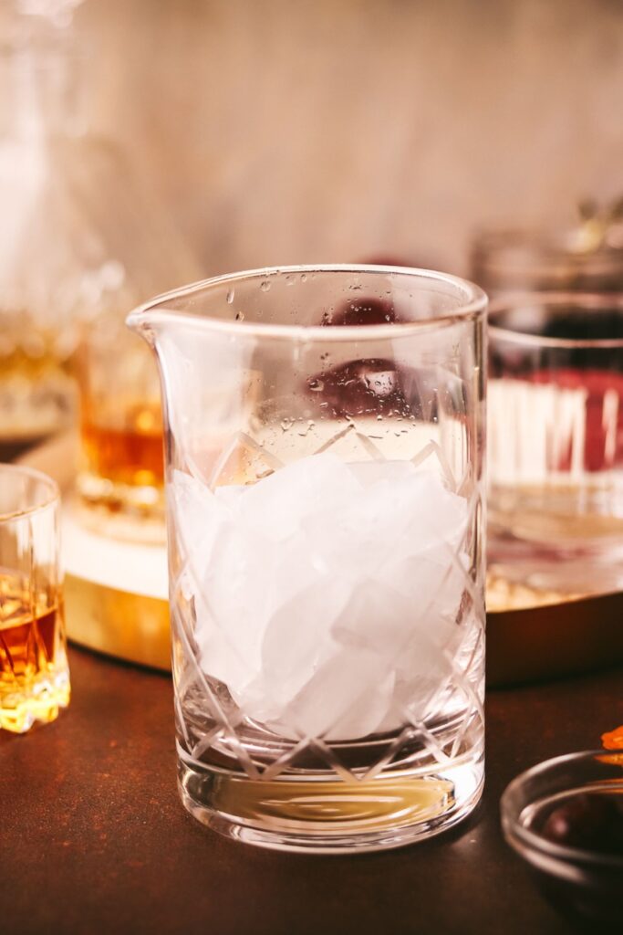 Step one: a cocktail mixer half filled with ice. 