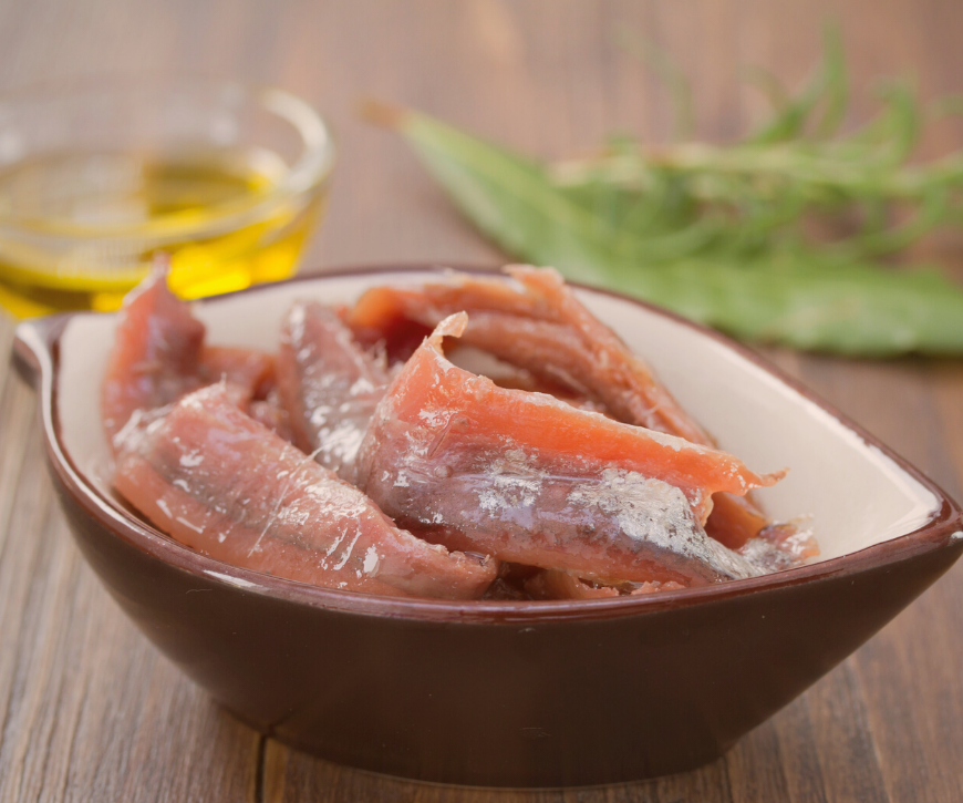 A small bowl of anchovy fillets