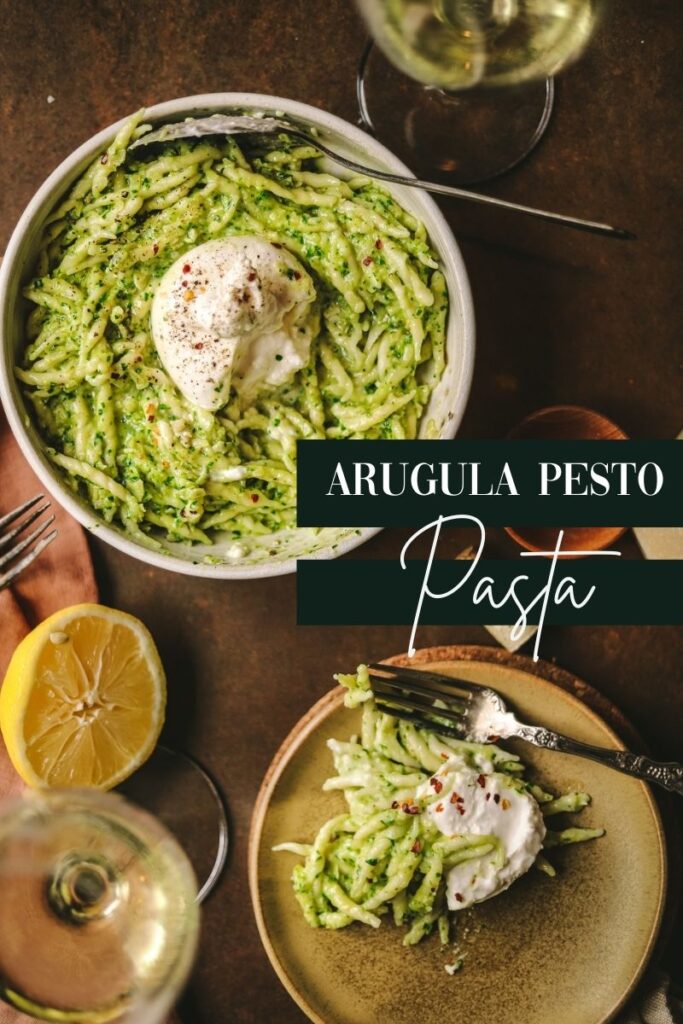 A photo of a bowl filled with arugula pasta