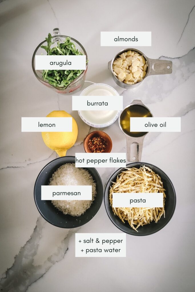 Ingredients needed to make arugula pesto pasta