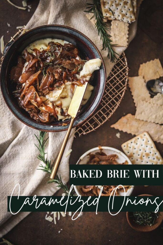 A photo of baked brie with caramelized onions, rosemary and balsamic vinegar