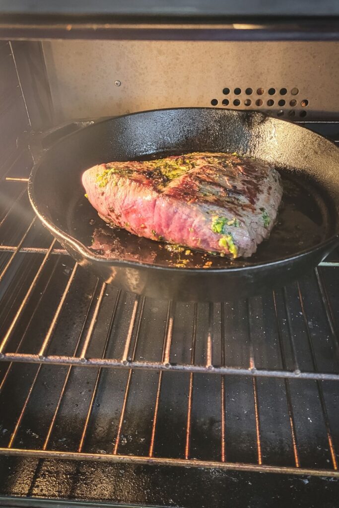 Cooking steak in the cast iron in the oven. 