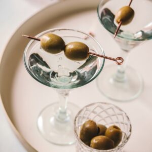 a dirty martini with two olives