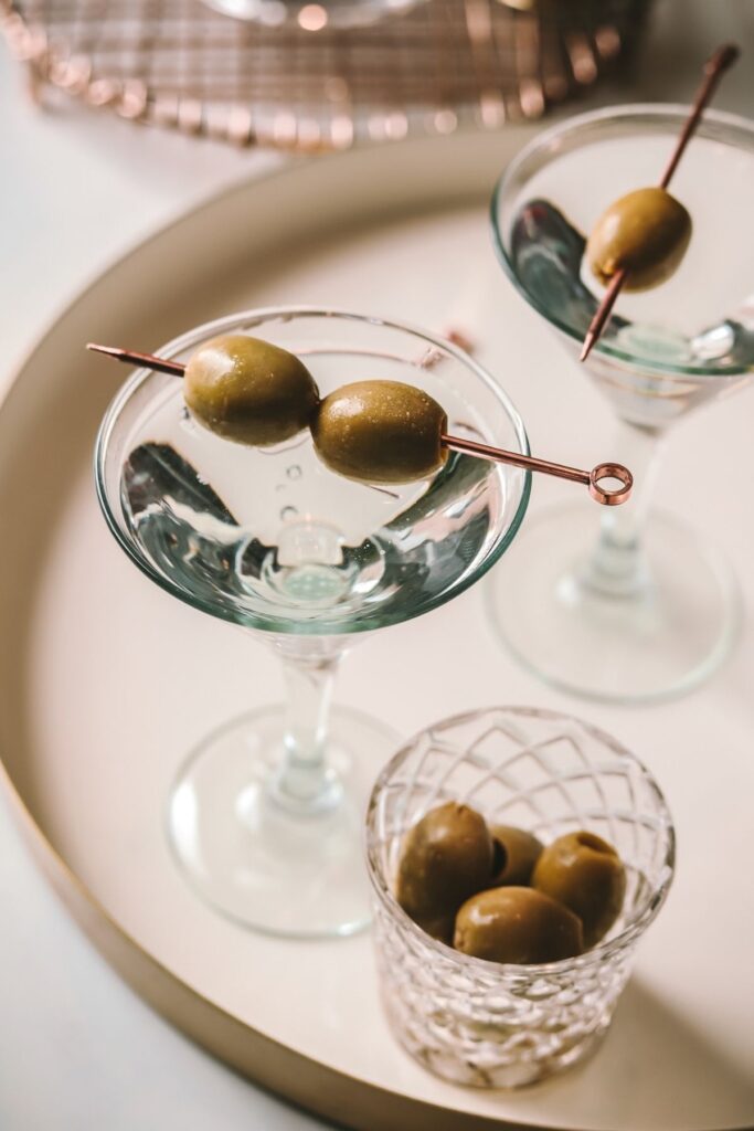 two dry martinis with olives