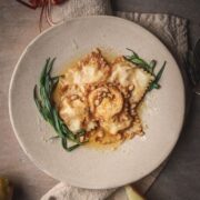 a plate of lobster ravioli with tarragon