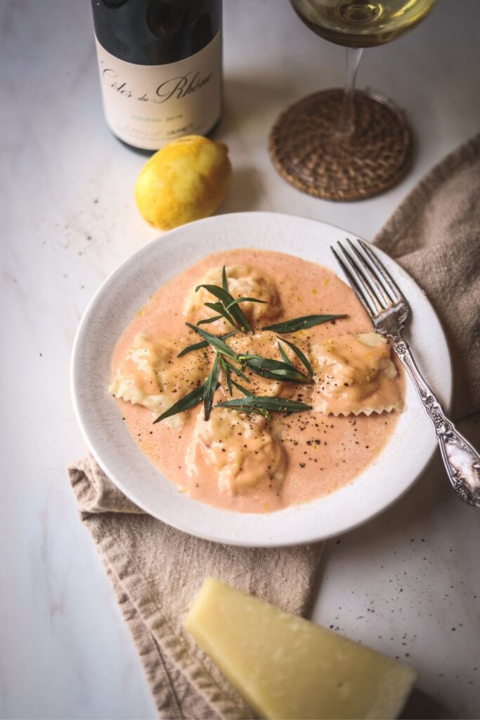 An overhead shot of lobster ravioli sauce with lobster ravioli