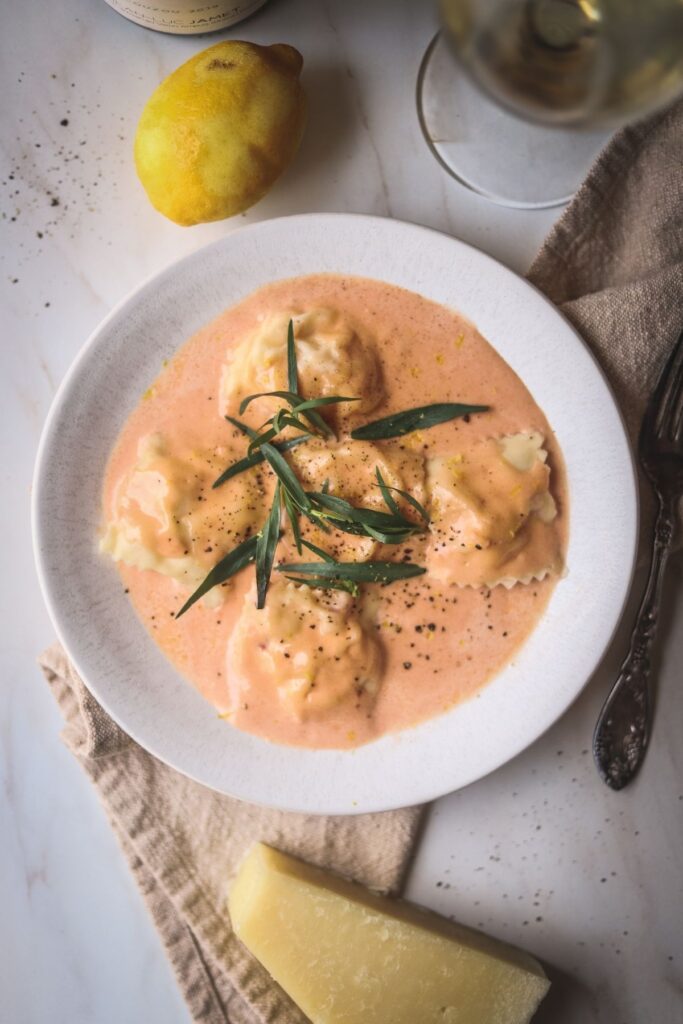 An overhead shot of lobster ravioli sauce with lobster ravioli