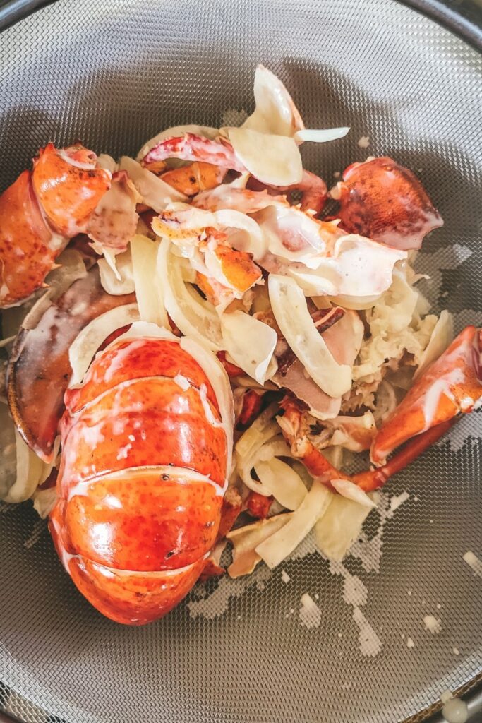 Straining the lobster ravioli sauce