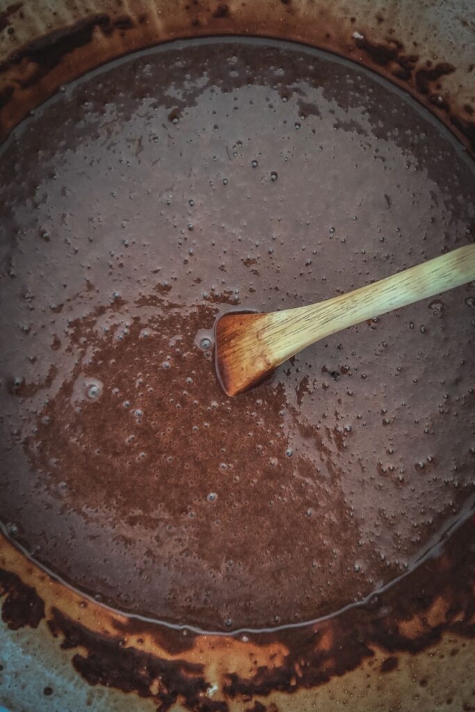 orange chocolate cake process shot, wet ingredients mixed in.