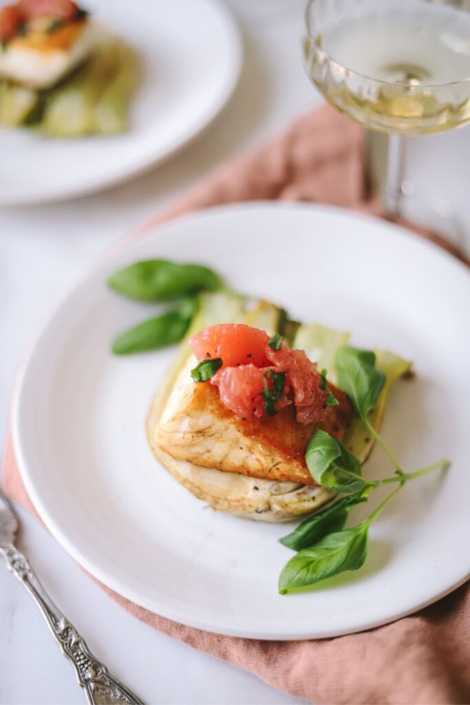 A photo of pan-seared halibut with roasted fennel and grapefruit salsa