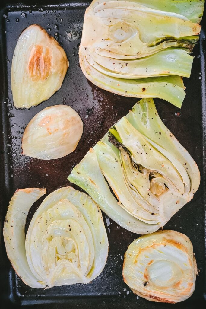 fennel on a baking sheet after it's been roasted