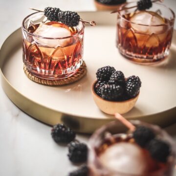 A photo of a peanut butter whiskey cocktail with raspberry liqueur