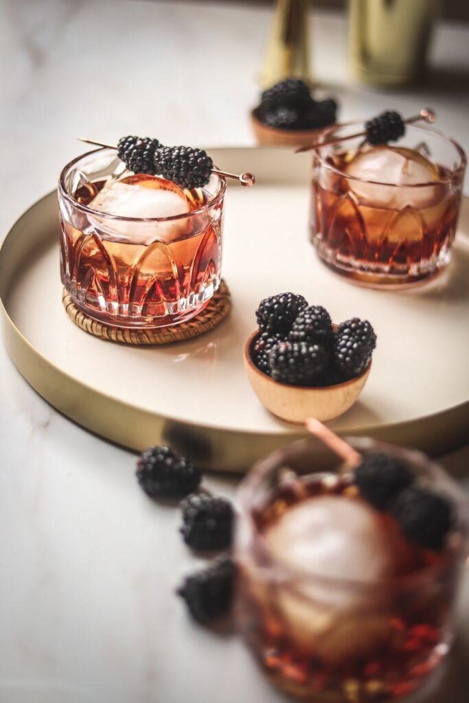 A photo of a peanut butter whiskey cocktail with raspberry liqueur