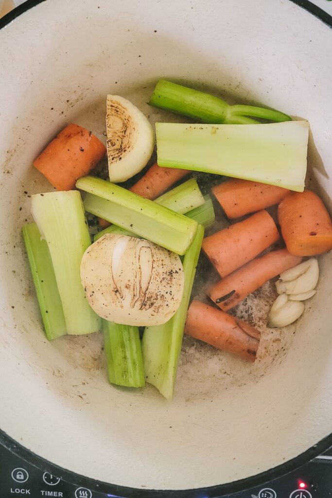 Adding your carrots, celery, onion, garlic
