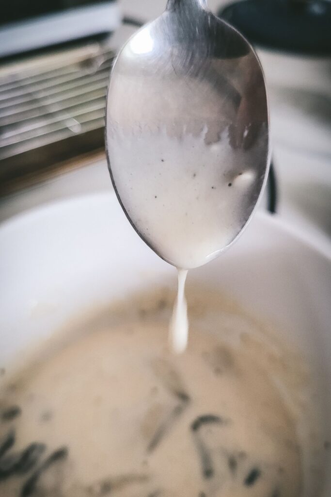 A photo showing the batter dripping off a spoon