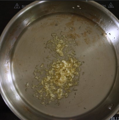 garlic and oil in a pan. 