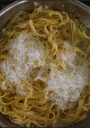 pasta cheese and oil in a pan