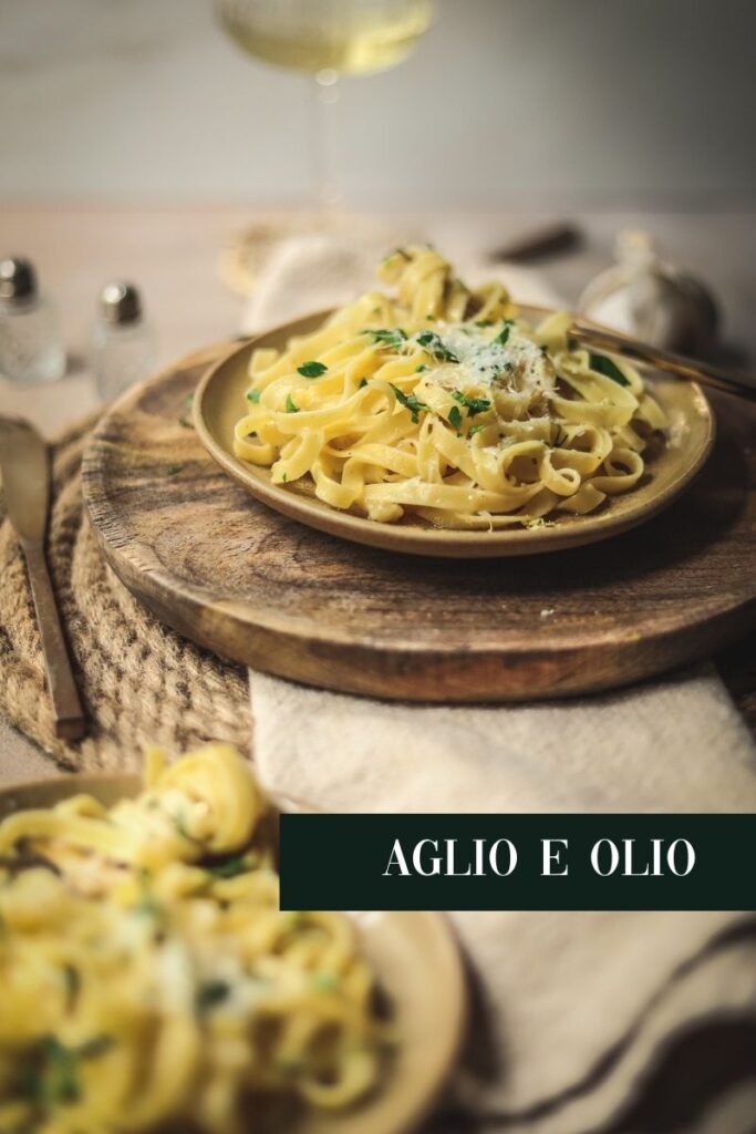A photo of pasta aglio e olio, or pasta without sauce, with title text.