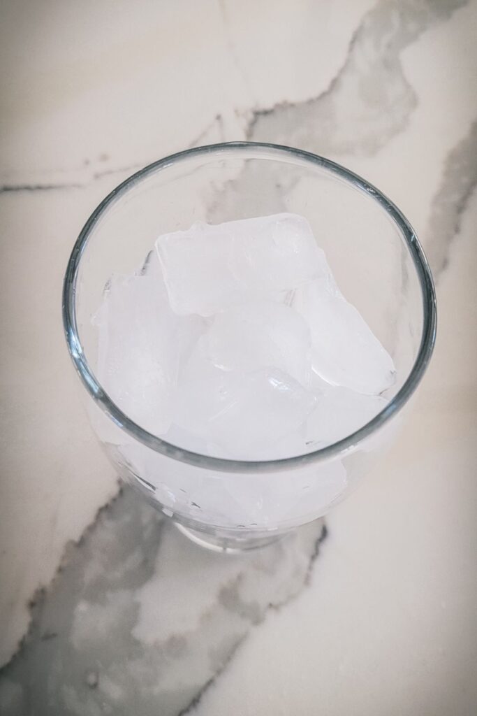 A drinking glass full of ice. 