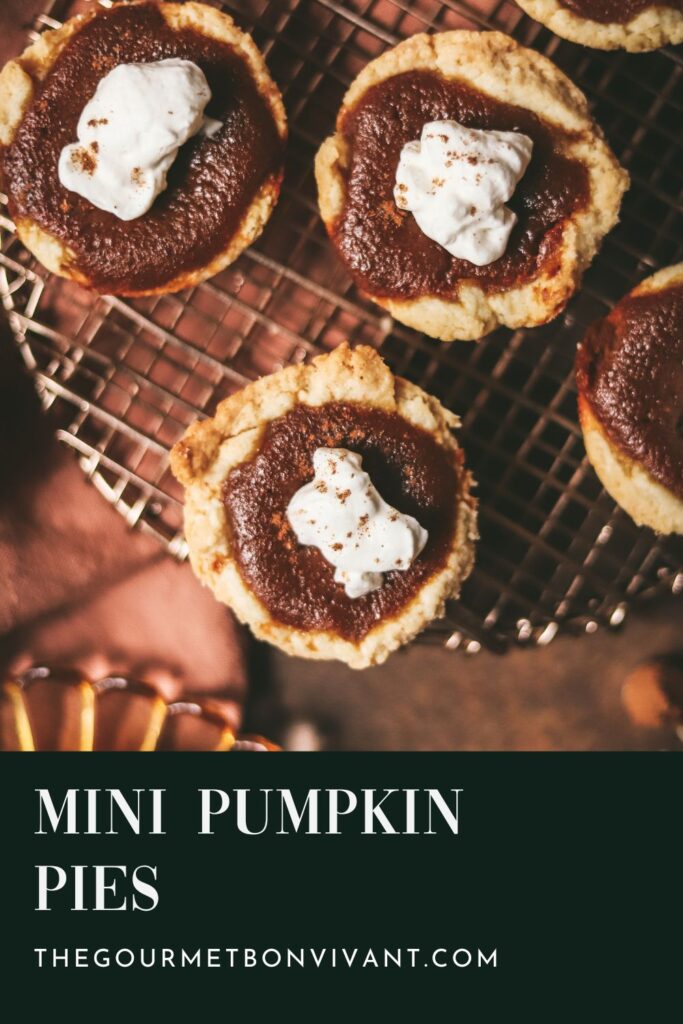 Three mini pumpkin pies on a cooling rack with title text.
