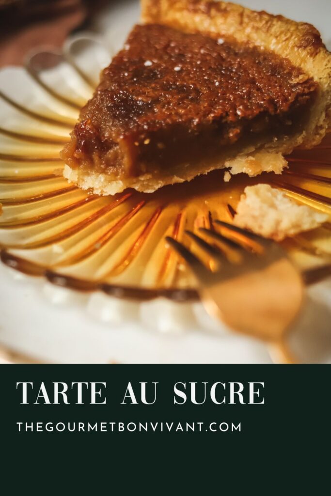 Tarte au sucre on a plate with a gold fork.
