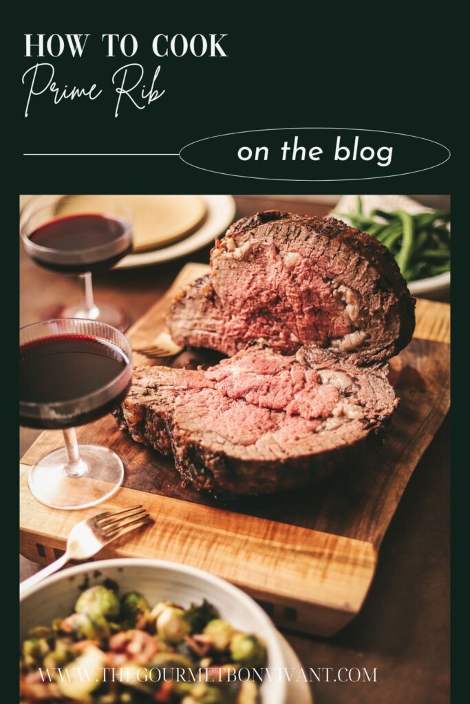 Prime rib with red wine, sides and title text on dark green background.
