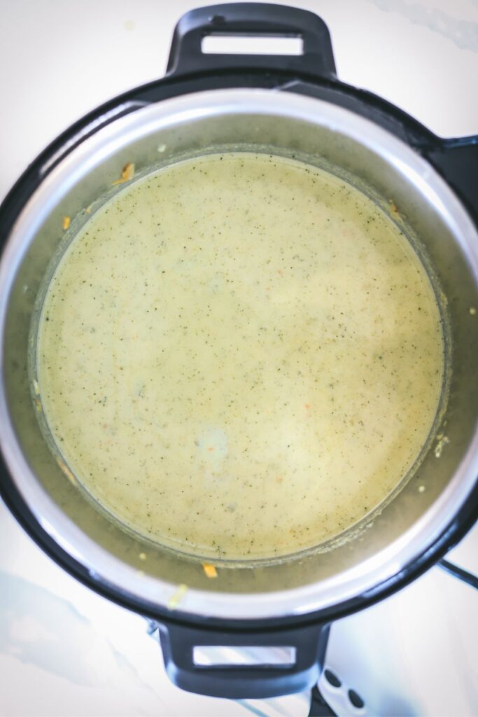 Broccoli soup in the instant pot, blended, milk and cheese added. 