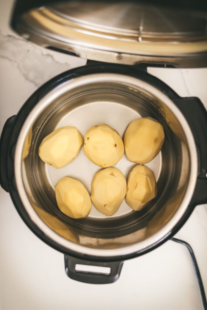 Potatoes in an Instant Pot with water.