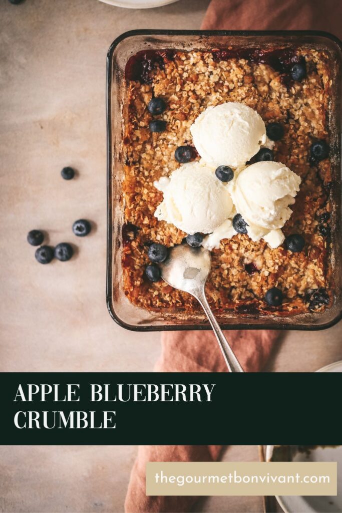 A baking pan of apple and blueberry crumble with title text.