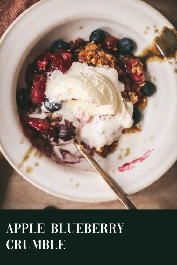Apple blueberry crumble with ice cream and title text.