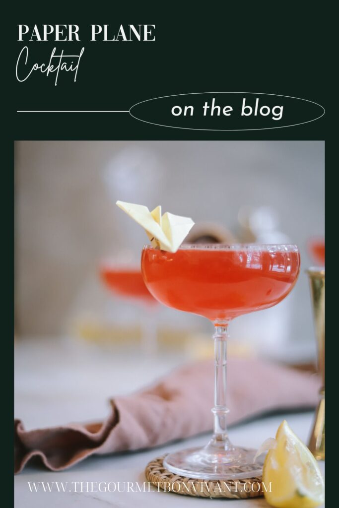 A paper plane cocktail with title text.