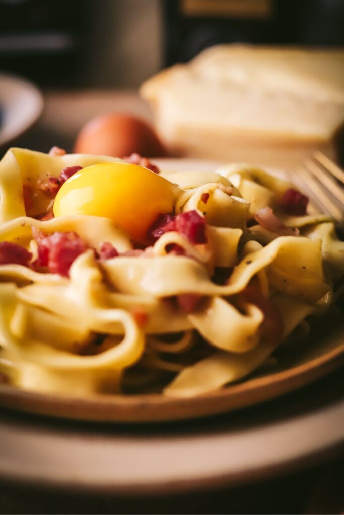 Handmade tagliatelle carbonara with pancetta and parmesan cheese. 