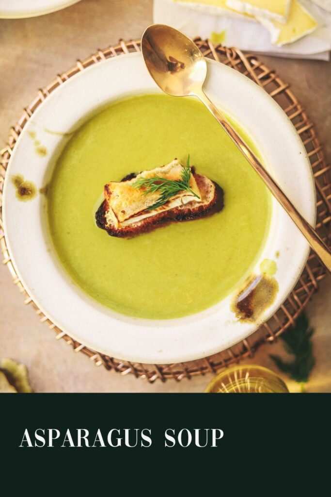 Bowl of asparagus soup with title text.