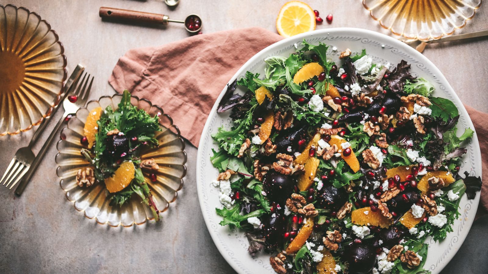 A beet salad with oranges and pomegranate seeds