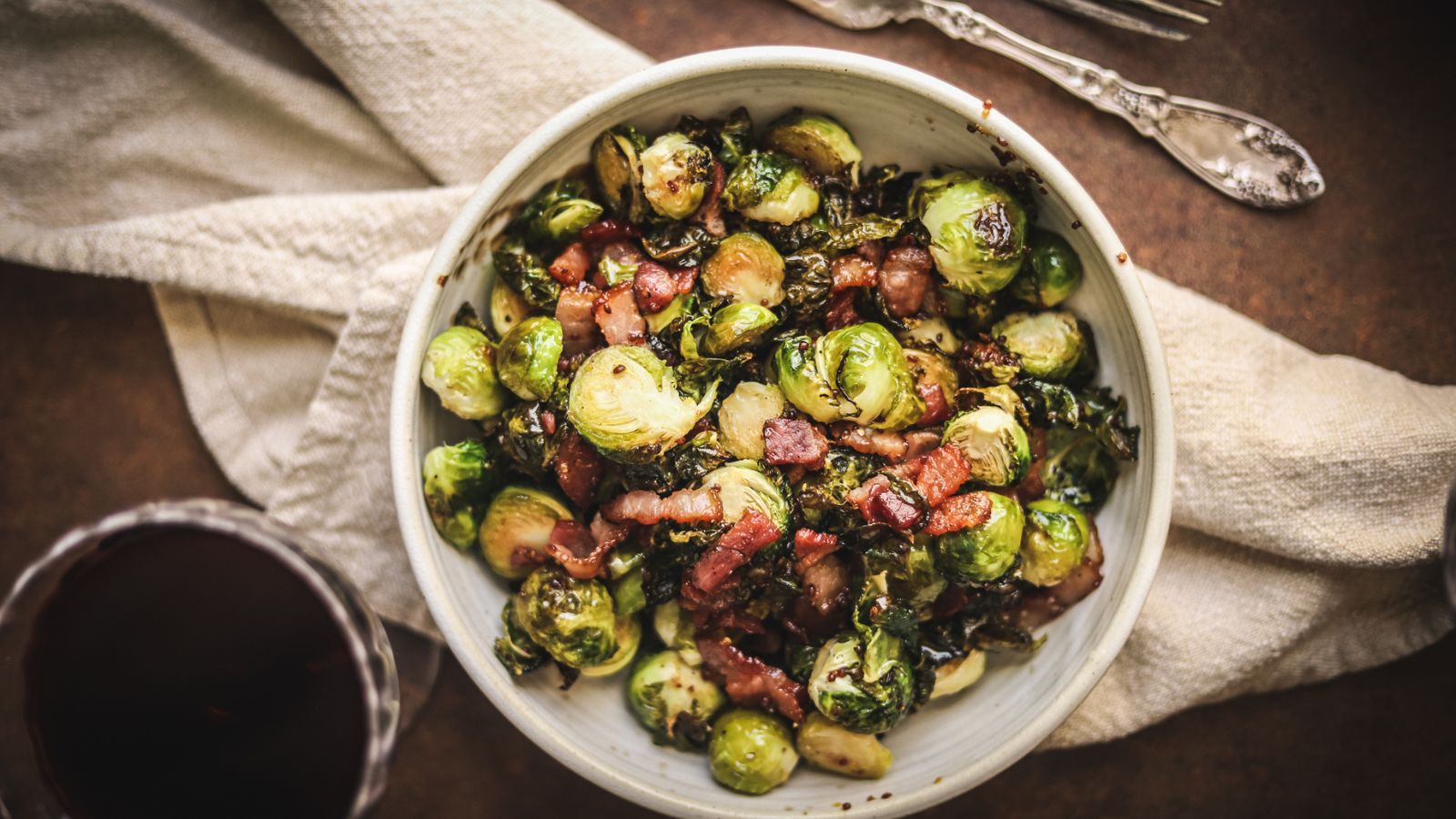 A bowl of brussel's sprouts with bacon and maple mustard glaze. 
