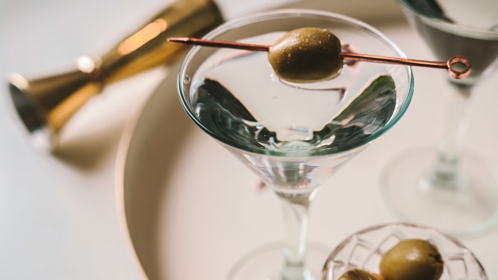 A dry dirty martini garnished with olives. 
