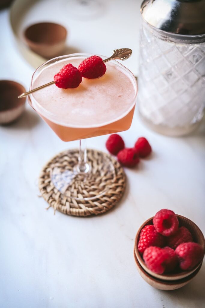 A french martini garnished with fresh raspberries. 