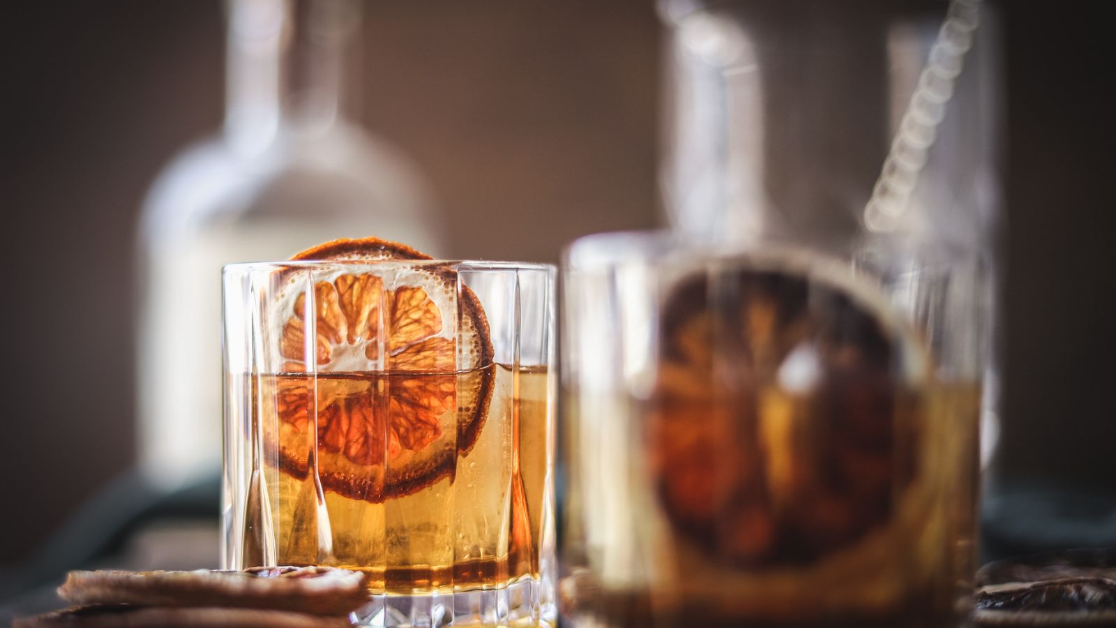 A maple old fashioned with a dried orange. 