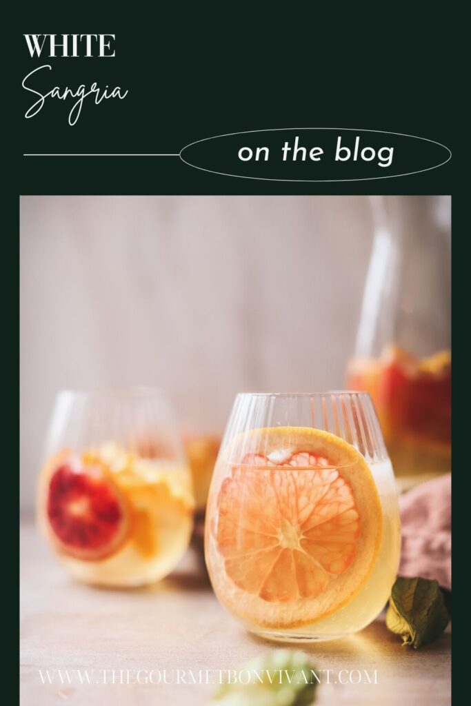 A glass of sangria with grapefruit and title text.